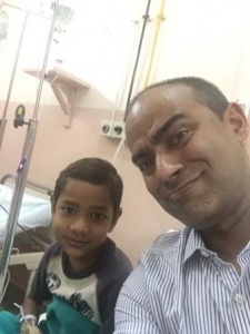 Dr. Dhruv Ghosh with a young patient